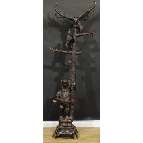 1582 - A Black Forest hall stand, carved in the traditional manner with a bear beside a tree, guarding her ... 