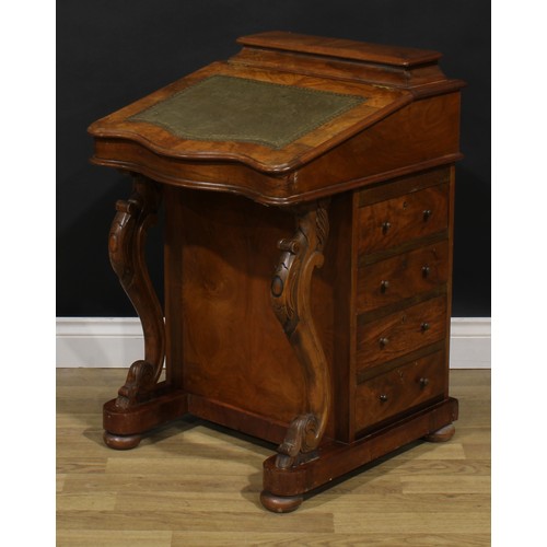 2066 - A Victorian walnut Davenport desk, hinged superstructure enclosing stationery divisions, the hinged ... 