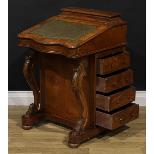 2066 - A Victorian walnut Davenport desk, hinged superstructure enclosing stationery divisions, the hinged ... 