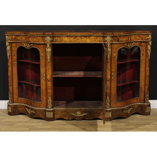 2067 - A Victorian gilt metal mounted walnut and marquetry credenza, slightly oversailing top above a centr... 