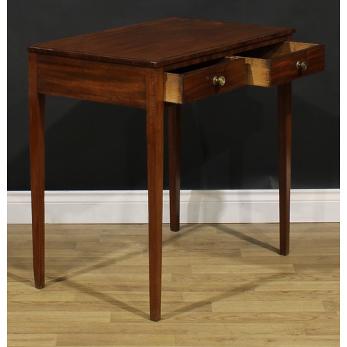 1812 - A George III mahogany side table, crossbanded rectangular top above a pair of frieze drawers, tapere... 