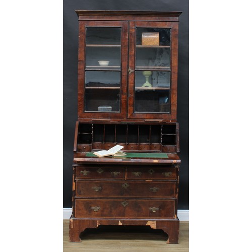 1590 - A George I/II walnut bureau bookcase, moulded cornice above a pair of glazed doors and candle slides... 