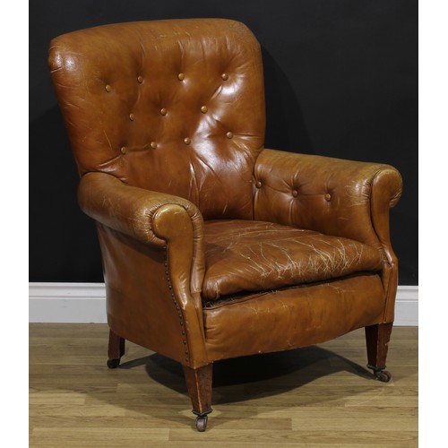 2071 - An early 20th century club armchair, stuffed-over upholstery, tapered square forelegs, ceramic caste... 