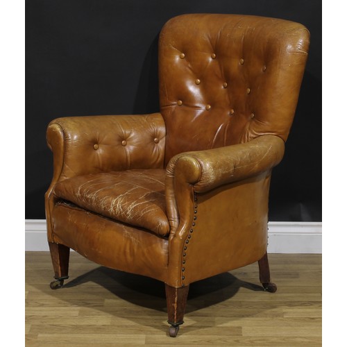 2071 - An early 20th century club armchair, stuffed-over upholstery, tapered square forelegs, ceramic caste... 