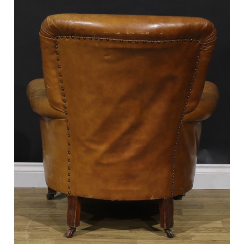 2071 - An early 20th century club armchair, stuffed-over upholstery, tapered square forelegs, ceramic caste... 