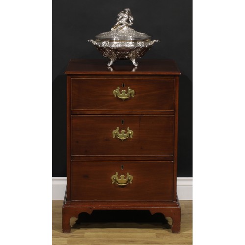 1620 - A 19th century mahogany chest, of unusual proportions and three long cockbeaded drawers, brass swing... 