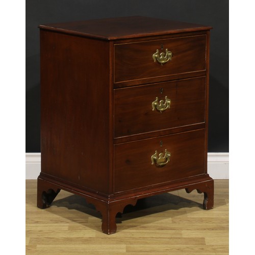 1620 - A 19th century mahogany chest, of unusual proportions and three long cockbeaded drawers, brass swing... 