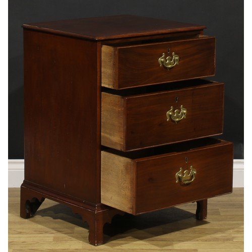 1620 - A 19th century mahogany chest, of unusual proportions and three long cockbeaded drawers, brass swing... 