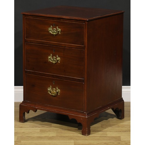 1620 - A 19th century mahogany chest, of unusual proportions and three long cockbeaded drawers, brass swing... 