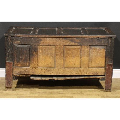 1623 - A Charles II oak four panel blanket chest, hinged top above a lunette carved frieze, stile feet, 75c... 