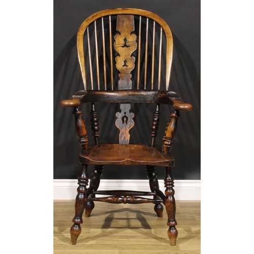 1577 - A 19th century Yorkshire beech, ash and elm Windsor elbow chair, shaped and pierced splat, saddle se... 