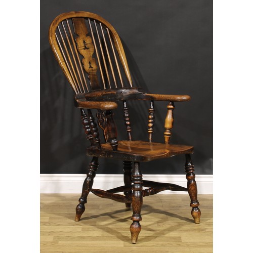 1577 - A 19th century Yorkshire beech, ash and elm Windsor elbow chair, shaped and pierced splat, saddle se... 