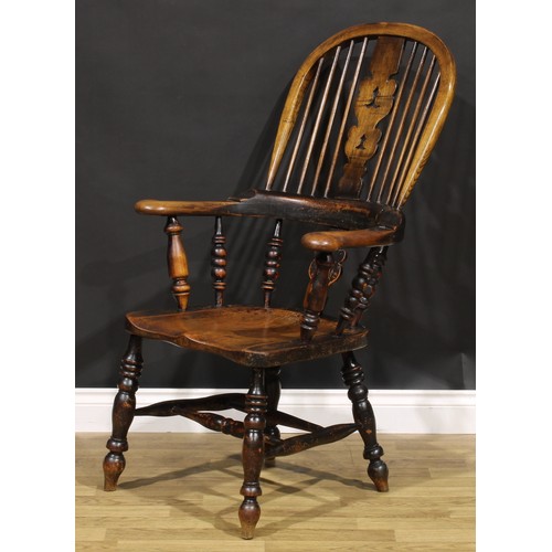 1577 - A 19th century Yorkshire beech, ash and elm Windsor elbow chair, shaped and pierced splat, saddle se... 