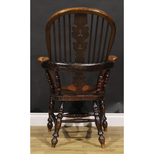 1577 - A 19th century Yorkshire beech, ash and elm Windsor elbow chair, shaped and pierced splat, saddle se... 