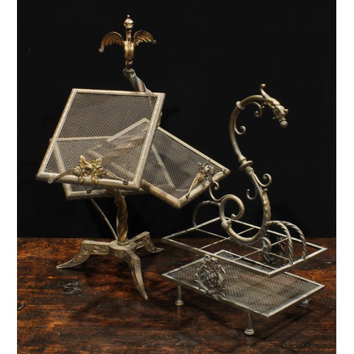 2037 - An unusual early 20th century brass periodical stand, wyvern finial above an asymmetrical arrangemen... 