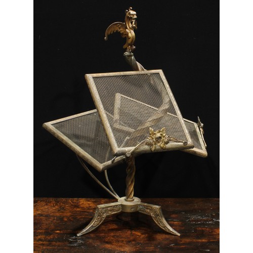 2037 - An unusual early 20th century brass periodical stand, wyvern finial above an asymmetrical arrangemen... 