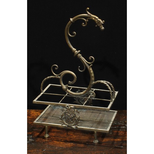 2037 - An unusual early 20th century brass periodical stand, wyvern finial above an asymmetrical arrangemen... 