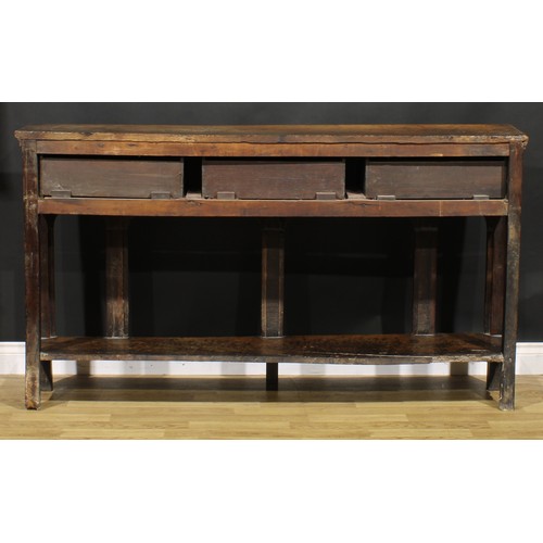 2074 - An 18th century oak low potboard dresser, of shallow proportions, rectangular top above three frieze... 