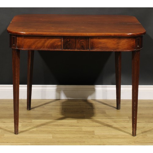 2075 - A George IV mahogany tea table, hinged top above a deep frieze centred by a rectangular tablet, tape... 