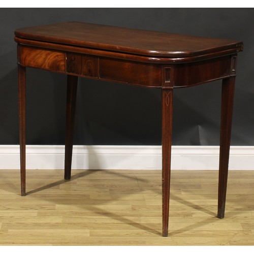 2075 - A George IV mahogany tea table, hinged top above a deep frieze centred by a rectangular tablet, tape... 