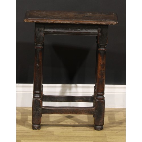 2079 - An early 18th century oak joint stool, rectangular top above a moulded frieze, turner and blocked le... 