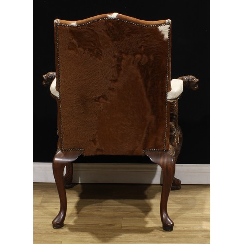 1597 - A pair of George II style mahogany Gainsborough chairs, boldly carved in the Irish Rococo taste with... 