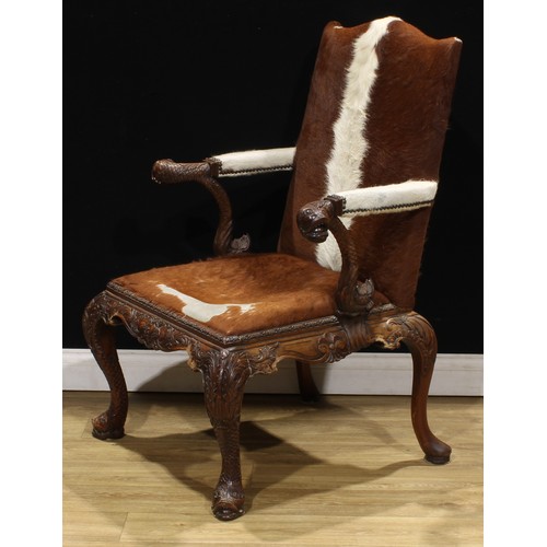 1597 - A pair of George II style mahogany Gainsborough chairs, boldly carved in the Irish Rococo taste with... 