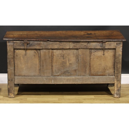 1583 - A Charles II oak blanket chest, the lunette carved frieze above three panels, inlaid in indigenous t... 