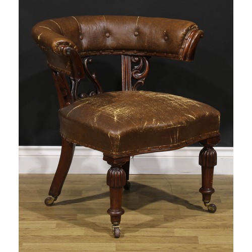 2080 - A Victorian mahogany club or desk chair, stuffed-over upholstery, turned legs, ceramic casters, 73cm... 