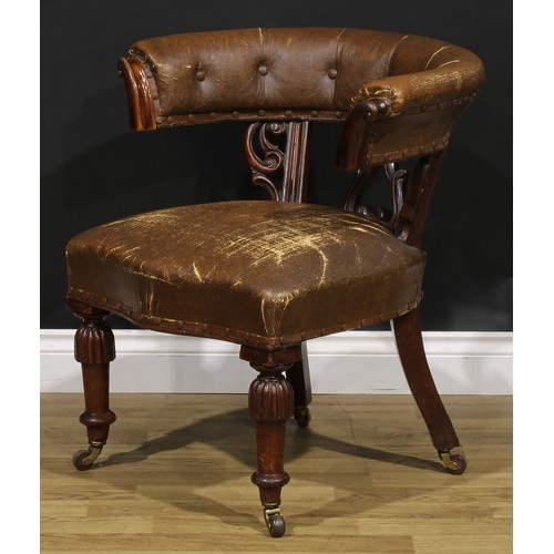 2080 - A Victorian mahogany club or desk chair, stuffed-over upholstery, turned legs, ceramic casters, 73cm... 