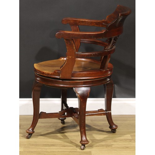 2081 - An early 20th century walnut swivel desk chair, by The Globe-Wernicke Co Ltd, 85cm high, 62.5cm wide... 