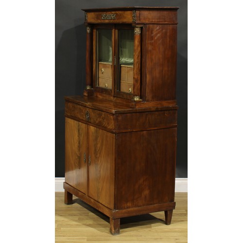 1586 - A French Empire gilt metal mounted mahogany side cabinet, frieze drawer above a pair of glazed doors... 