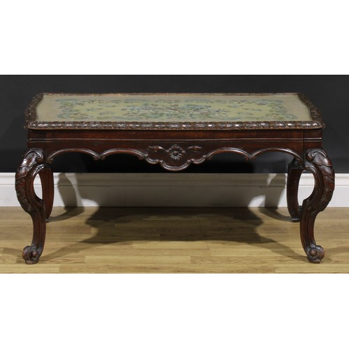 1909 - A Victorian mahogany low sitting room table, shaped rectangular top with glazed woolwork panel, shap... 