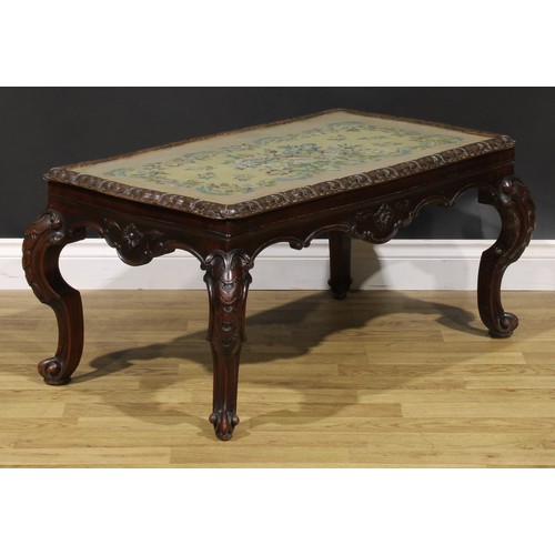 1909 - A Victorian mahogany low sitting room table, shaped rectangular top with glazed woolwork panel, shap... 