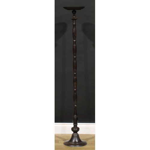 1627 - A Chinese bronze torchere or lamp stand, the dished top centred by a four character mark, 139cm high... 