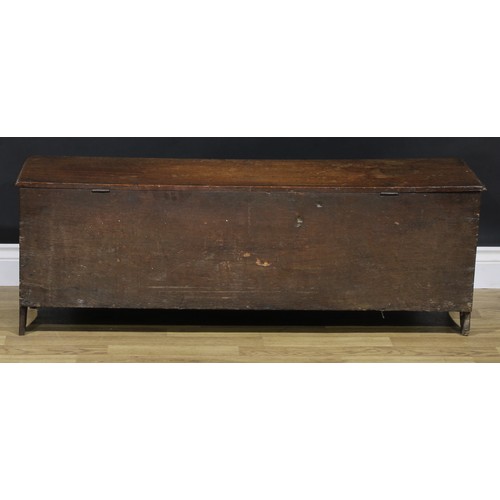 2114 - An 18th century oak six-plank chest, hinged top enclosing a till and a drawer, 47cm high, 120cm wide... 