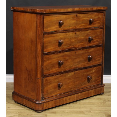 2040 - An unusual Victorian mahogany chest, fall front enclosing four sliding linen trays, above three long... 