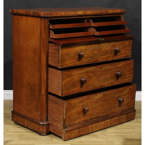 2040 - An unusual Victorian mahogany chest, fall front enclosing four sliding linen trays, above three long... 