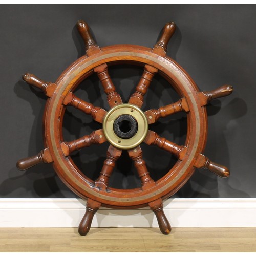 2116 - An early 20th century brass bound oak ship’s wheel, iron hub, turned spokes, 93cm diameter