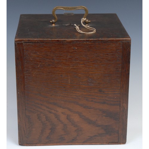 2155 - A late 19th century oak pigeon carrying box, brass handle, the fall front carved and applied with a ... 