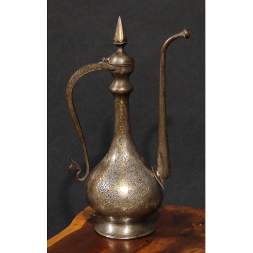 2129 - A Middle Eastern damascened steel ewer, chased in the Islamic taste with reserves of lotus and inlai... 