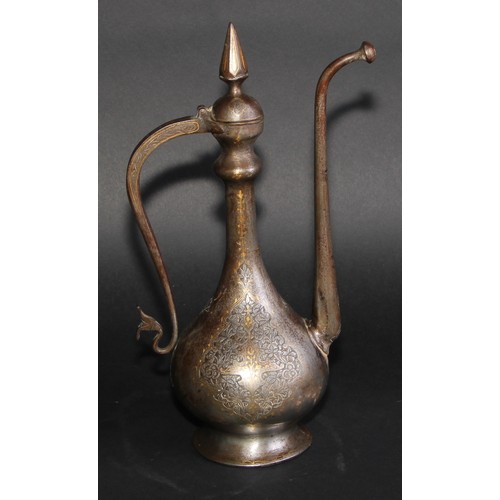 2129 - A Middle Eastern damascened steel ewer, chased in the Islamic taste with reserves of lotus and inlai... 