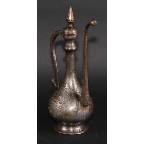 2129 - A Middle Eastern damascened steel ewer, chased in the Islamic taste with reserves of lotus and inlai... 