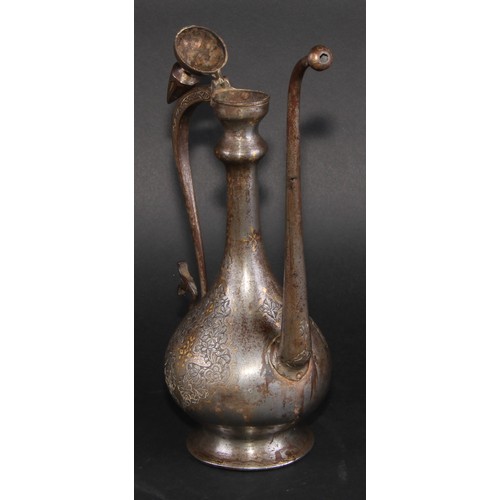 2129 - A Middle Eastern damascened steel ewer, chased in the Islamic taste with reserves of lotus and inlai... 