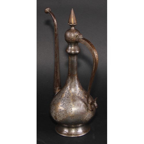 2129 - A Middle Eastern damascened steel ewer, chased in the Islamic taste with reserves of lotus and inlai... 