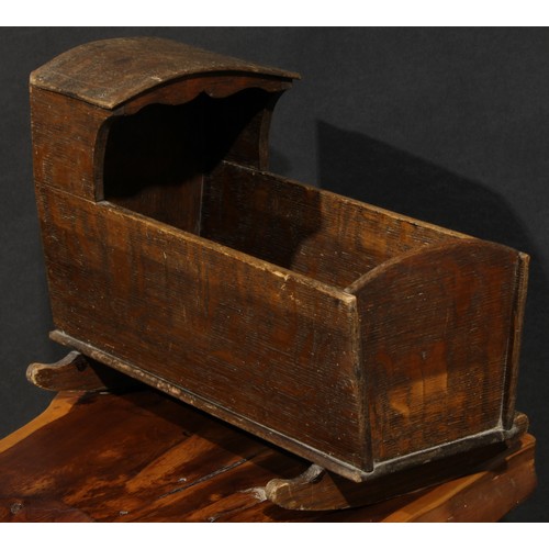 2052 - Miniature Furniture - an early 20th century oak folk art rocking crib, of traditional primitive form... 