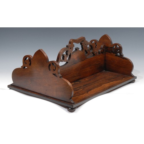 2100 - A William IV rosewood rectangular book carrier, double-sided, pierced and shaped end supports and di... 