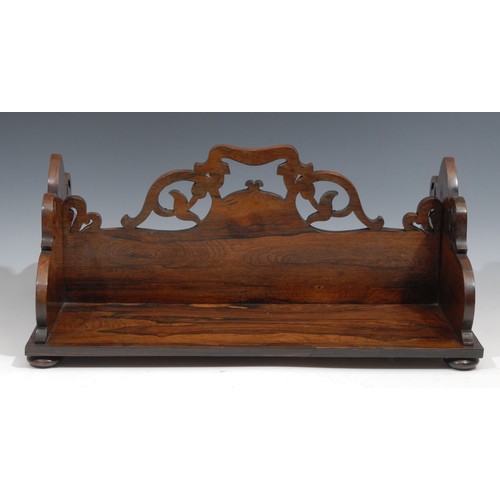 2100 - A William IV rosewood rectangular book carrier, double-sided, pierced and shaped end supports and di... 