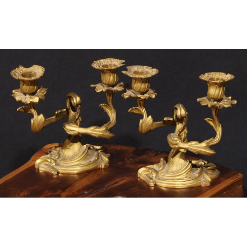 2163 - A pair of 19th century Rococo Revival gilt bronze two-light candelabra, cast throughout with scrolli... 