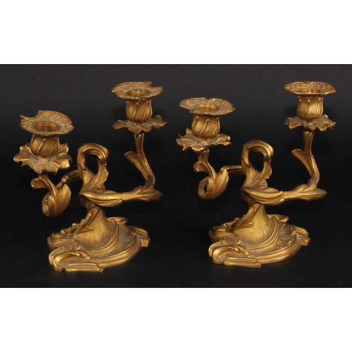 2163 - A pair of 19th century Rococo Revival gilt bronze two-light candelabra, cast throughout with scrolli... 